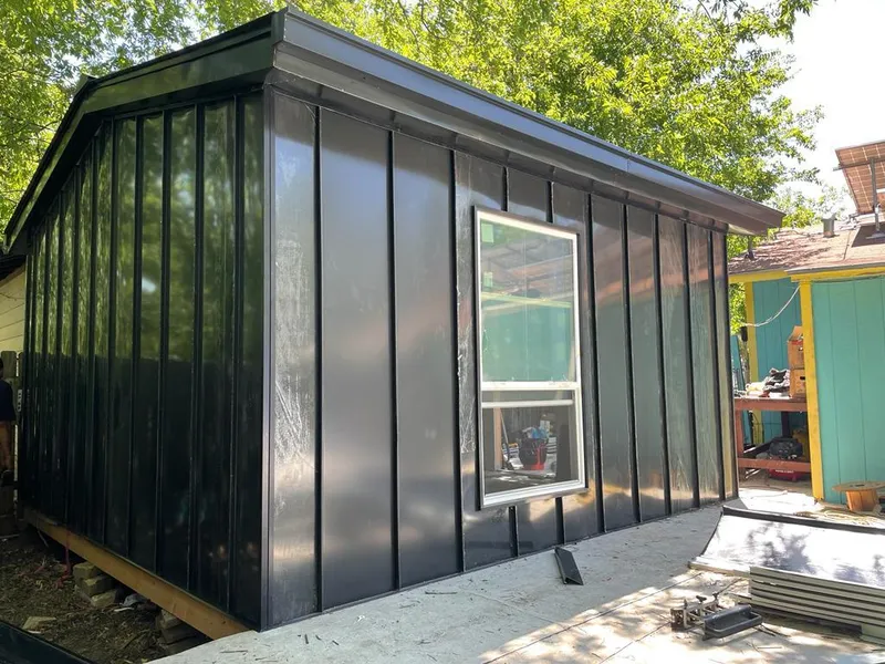 Black standing seam metal wall panels for Roof Inspection in Church Hill